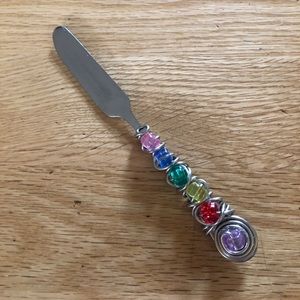 Embellished knife spreader